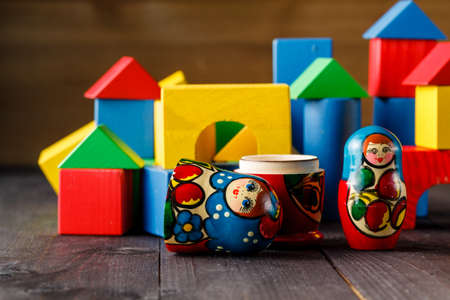 Toy house and family made of wood with blocksの写真素材