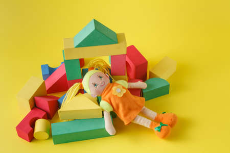 building blocks on bright yellow backgroundの写真素材