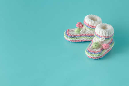 baby shoes on aquamarine backgroundの写真素材
