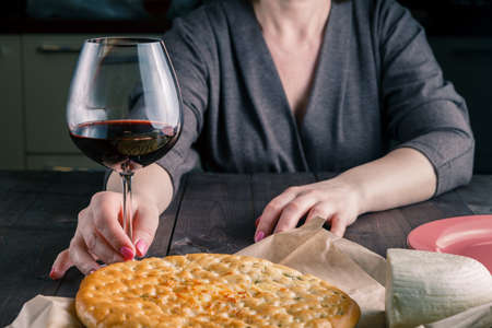 focaccia and wine on a wooden table. Mediterranean lunchの写真素材