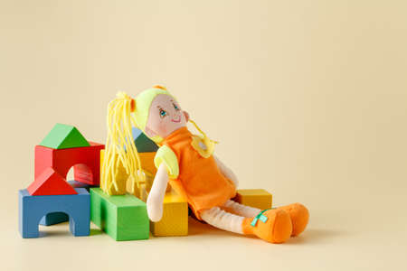 Baby play concept, cloth doll and wooden blocksの写真素材