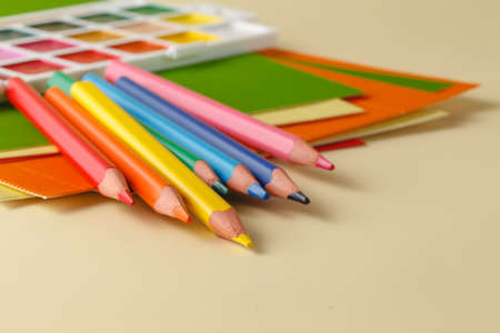 school supplies on plain beige backgroundの写真素材