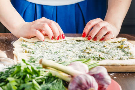 preparing Stuffed French Bread with olivesの写真素材