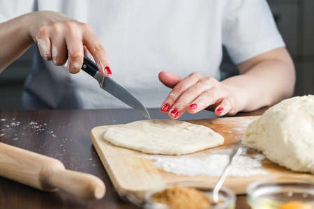 cuts the dough for preparing cookiesの写真素材
