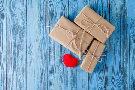 Few present box on blue wooden tableの写真素材