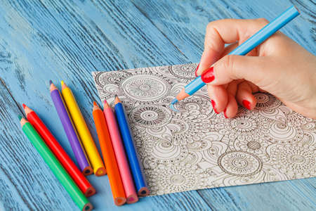 adult coloring books colored pencils anti-stress tendencyの写真素材
