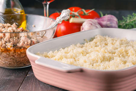 Homemade traditional lasagna.  raw ingredients on tableの写真素材