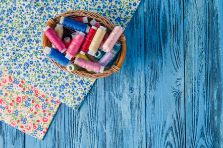 Colored sewing threads on a old work table