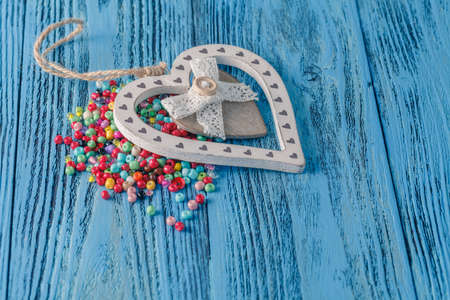 different colorful beads on the wooden tableの写真素材