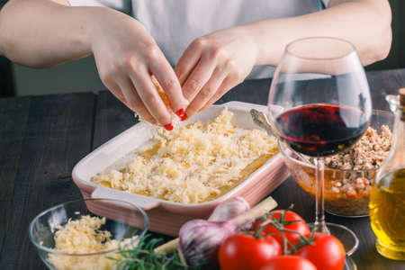 Woman make cannelloni with cheess. mediterranean cuisine cookind