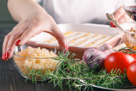Woman make cannelloni with cheese. mediterranean cuisine cookindの写真素材