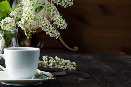 chocolate and flowers of cherry-bird with cup of coffee, selective focusの写真素材