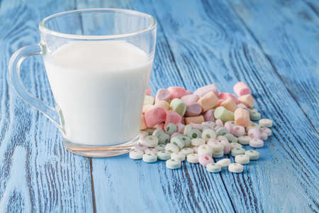 Candy on a blue pastel colored backgroundの写真素材