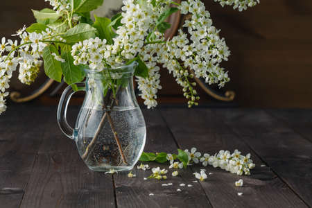 Spring bouquet in vase on wooden backgroundの写真素材