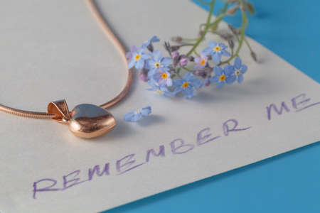 Message remember me with flowers of forget me notの写真素材