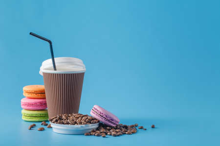 Paper cup of coffee and coffee beansの写真素材
