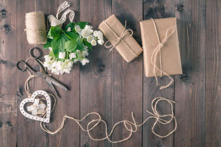 bouquet of white flowers on a wooden rustic tableの写真素材