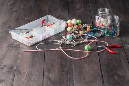 accessory for making home craft art jewellery layout on wooden tableの写真素材