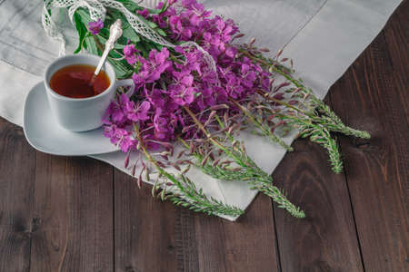 Summer tea on wooden table with macaroonの写真素材