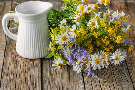 Chamomile flowers on a wooden background. Studio photograpの写真素材