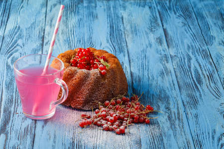 red fruit-drink with berries and cakeの写真素材