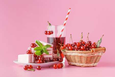 Fresh milk, cherry drink on pink table, assorted protein cocktail with fresh berriesの写真素材