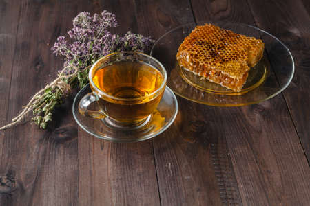 Herbal tea and honey on rustic wooden tableの写真素材