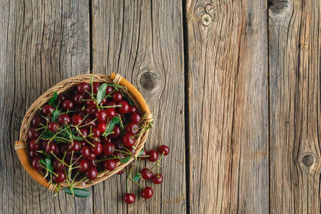 Ripe cherries on wooden table. View from above with copy spaceの写真素材