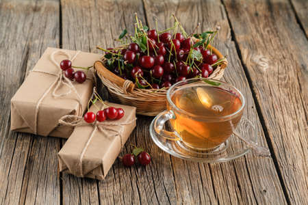 Festive sweet breakfast with cherry and teaの写真素材