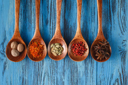 culinary background with spices on wooden tableの写真素材