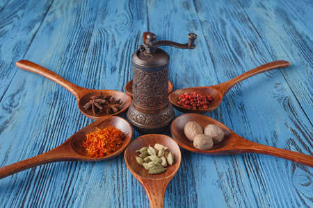 Six spoons full of spices on tableの写真素材