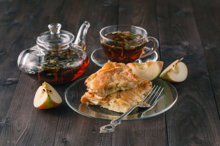 Preparation of homemade apple pie. Cup of teaの写真素材