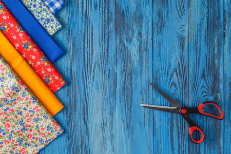 Sewing items on blue tableの写真素材