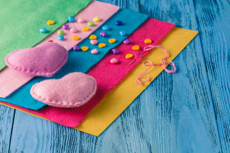 Pieces of cloth, buttons - a sewing kit on blue backgroundの写真素材