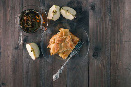 Apple pie on wooden table with teaの写真素材
