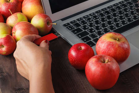 Few apple on a computer keyboardの写真素材
