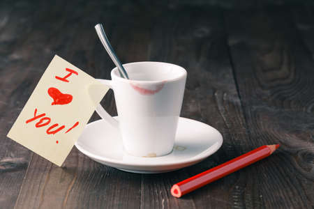 cup of coffee with red lipstick mark and love messageの写真素材
