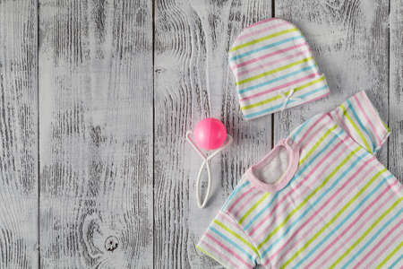 baby shirt on wooden desktop. Mock upの写真素材