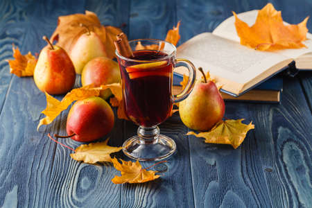 Mulled wine with orange and spices on dark background with copy spaceの写真素材