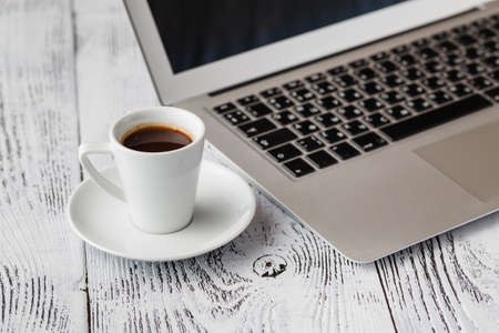 Breakfast while working on laptopの写真素材