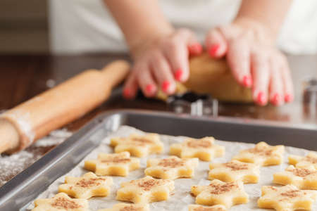 Baking cookies for Christmas. Cookies on baking sheet.の写真素材