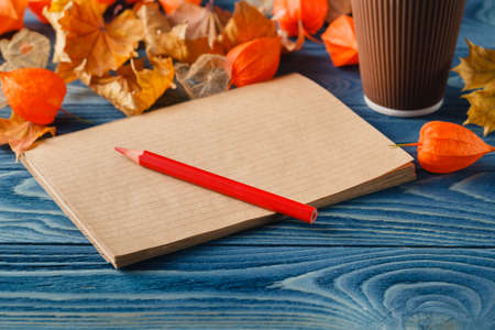 Autumn nostalgy notes on blue background tableの写真素材
