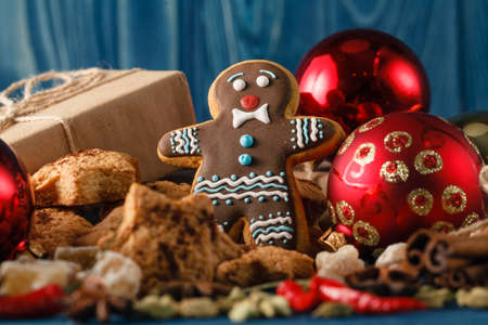 Christmas dinner on rustic table with cinnamon and gingerbread man