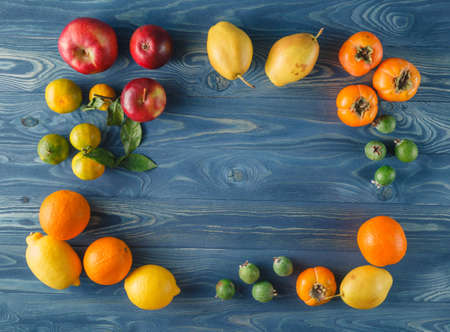 Fresh fruits on wooden boards frame backgroundの写真素材