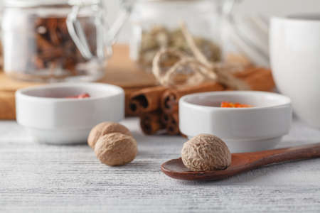 spices in a small ceramic cups on a white backgroundの写真素材