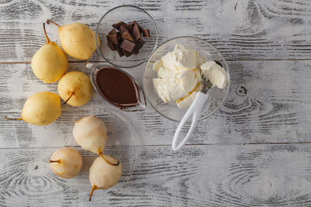 gourmet pear with chocolate and almondsの写真素材