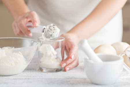 hands with Ingredients for homemade ice creamの写真素材