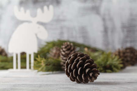 white christmas ornaments, xmas tree on rustic wood background. Merry christmas card. Winter holiday theme. Happy New Year.の写真素材