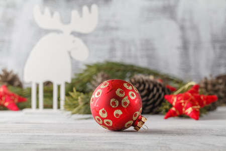 Funny christmas card with reindeer  for a greetings on a wooden backgroundの写真素材