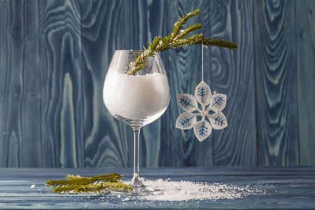glass for red wine with Christmas decorationの写真素材